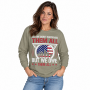 We Don't Know Them All, But We Owe Them All print on a garment-dyed women's long sleeve shirt