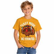Boy wearing the kids Feast Mode Activated turkey shirt