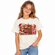 Girl wearing the Kids Highland Cow Christmas shirt