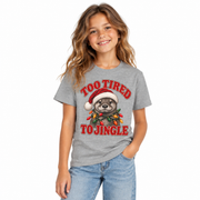 Girl wearing the kids Too Tired to Jingle otter Christmas shirt