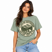 Model wearing the sage green I Love My Boyfriend camping badge shirt