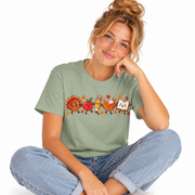 Thanksgiving teacher shirt in mint green with cute autumn and classroom characters