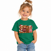 Toddler in the Toddler Highland Cow Christmas shirt with festive highland cows