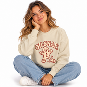Woman wearing the Oh Snap Gingerbread Christmas crewneck sweatshirt
