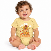 Baby wearing the Paw-sitively Thankful dog fall bodysuit