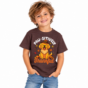 Boy wearing the Paw-sitively Thankful dog Thanksgiving shirt