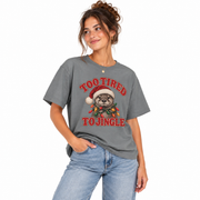 Woman wearing the Too Tired to Jingle otter Christmas shirt