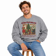 Men's Decking the Halls Christmas sweatshirt styled on a wooden stool