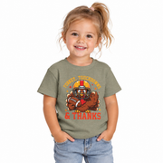 Toddler wearing the Turkey, Touchdowns and Thanks shirt