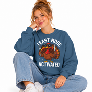 Woman wearing the Feast Mode Activated Thanksgiving crewneck sweatshirt
