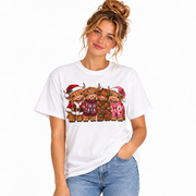Woman wearing the Women's Highland Cow Christmas shirt