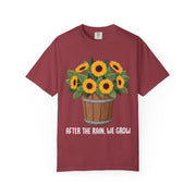 Bucket of sunflowers with After the Rain, We Grow underneath, on a chili red shirt