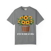 Bucket of sunflowers with After the Rain, We Grow underneath, on a grey shirt