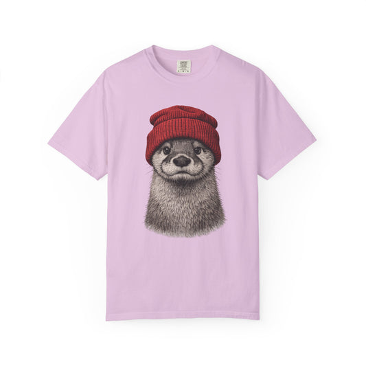Hand-drawn otter in a red knitted beanie on an orchid purple garment-dyed women's t-shirt
