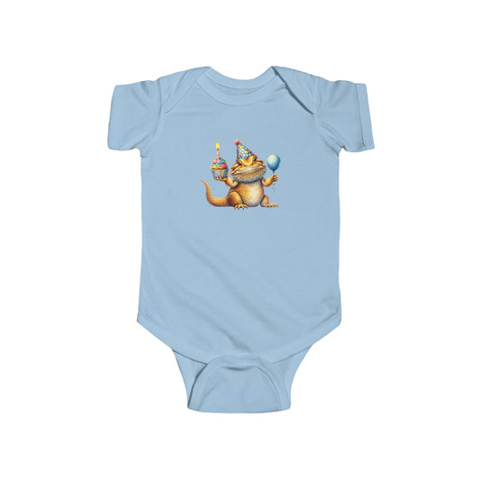 Bearded dragon in a party hat with a cupcake and balloon, on a light blue baby bodysuit