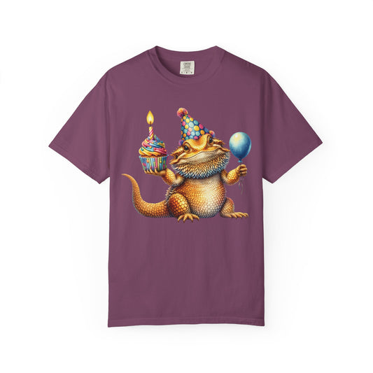 Bearded dragon in a party hat with a cupcake and balloon, on a berry men's shirt