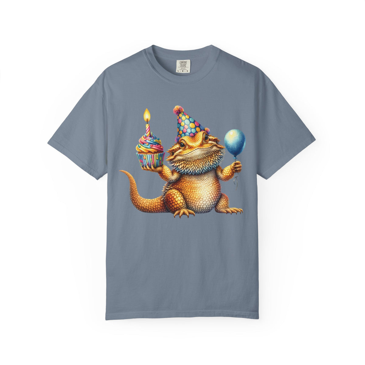Bearded dragon in a party hat with a cupcake and balloon, on a blue jean men's shirt