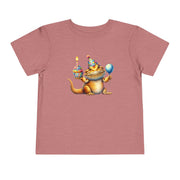 Bearded dragon in a party hat with a cupcake and balloon, on a heather mauve toddler shirt