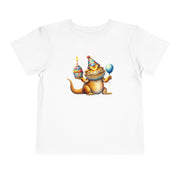 Bearded dragon in a party hat with a cupcake and balloon, on a white toddler shirt