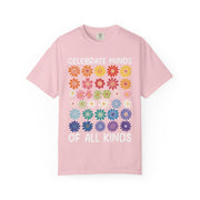 Celebrate Minds of All Kinds above a grid of mismatched flowers, on a blossom pink shirt