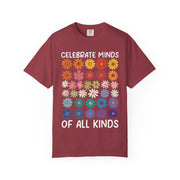 Celebrate Minds of All Kinds above a grid of mismatched flowers, on a chili red shirt