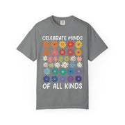 Celebrate Minds of All Kinds above a grid of mismatched flowers, on a grey shirt