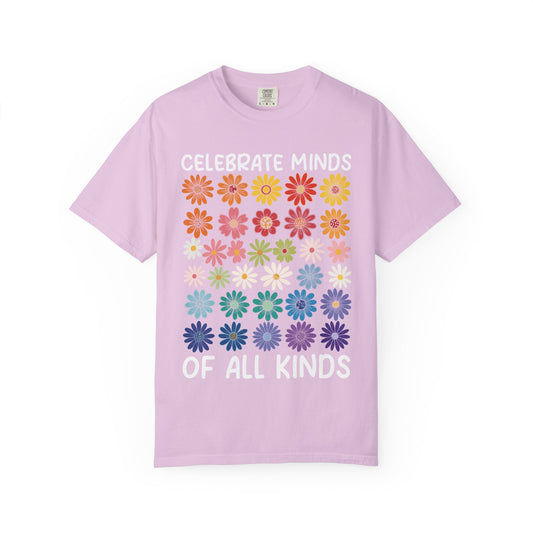 Celebrate Minds of All Kinds above a grid of mismatched flowers, on an orchid shirt