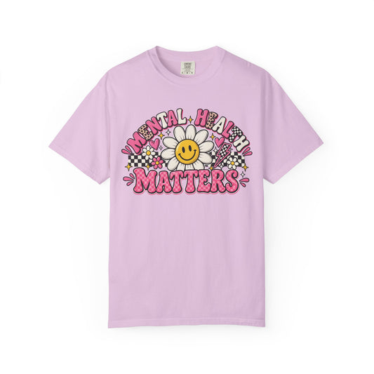 Mental Health Matters with a smiling daisy and pink checkerboard, on an orchid shirt