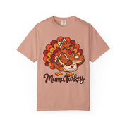 Mama Turkey matching Thanksgiving design on a peachy women's shirt