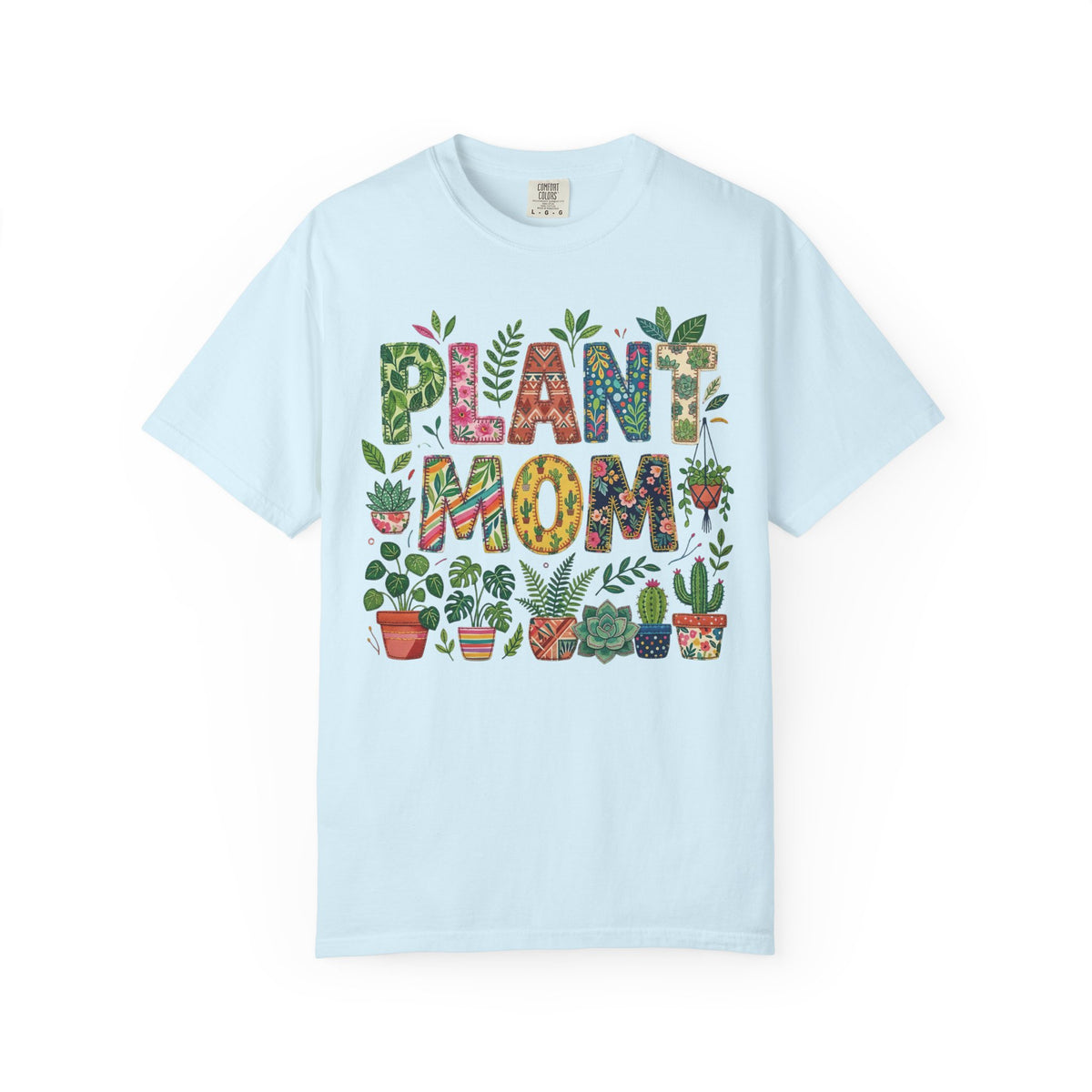 Split-colour monstera leaf with Plant Mom across the centre, on a chambray blue shirt