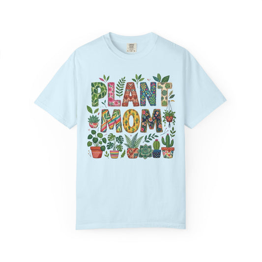 Split-colour monstera leaf with Plant Mom across the centre, on a chambray blue shirt
