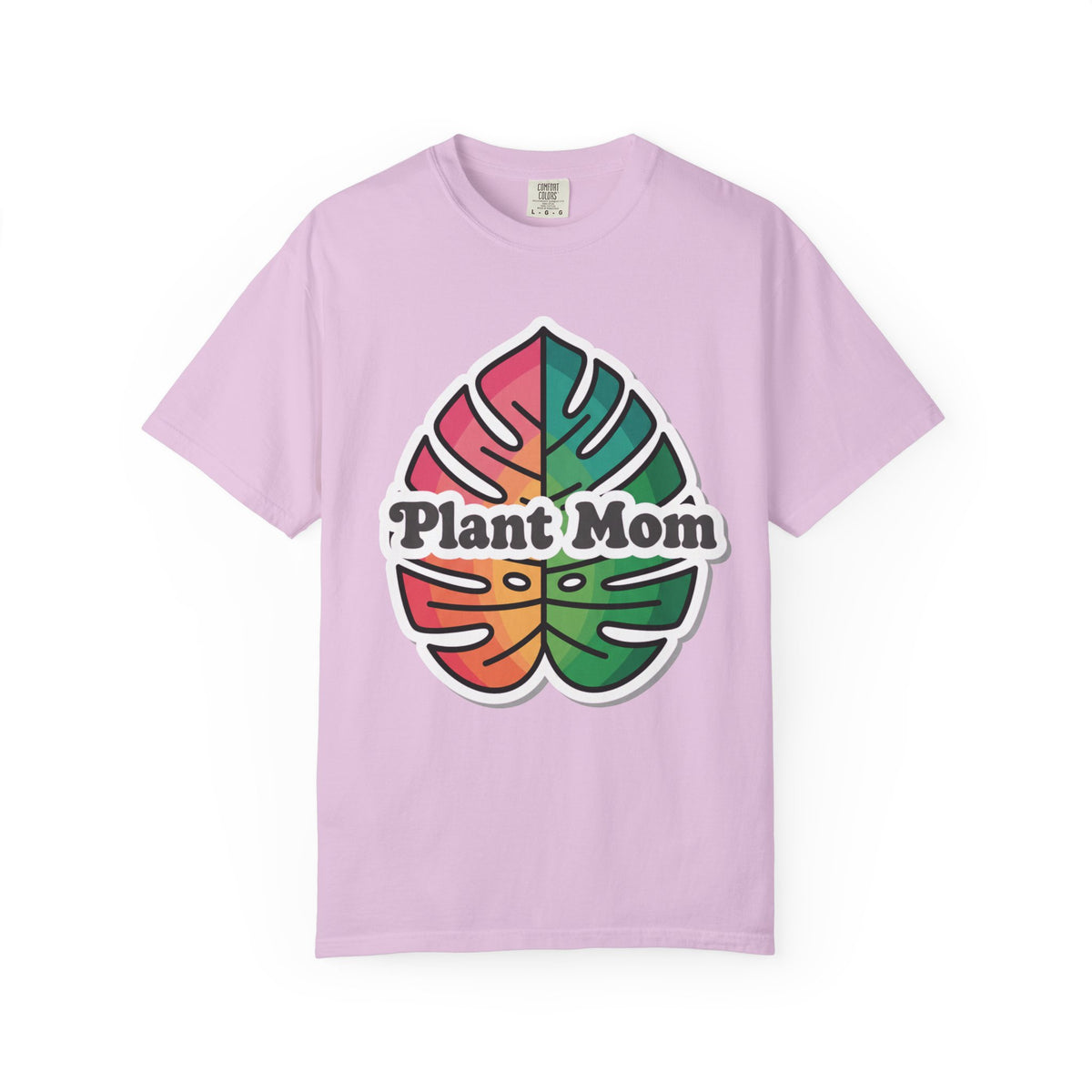 Plant Mom in patterned lettering above a row of houseplants, on an orchid shirt