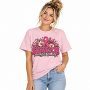 Woman wearing the Survivor And Still Blooming breast cancer survivor shirt