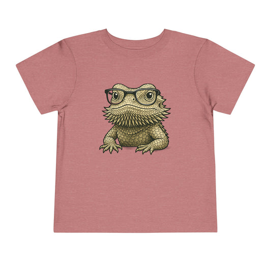 Bearded dragon in glasses, printed on a heather mauve toddler shirt