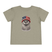 Otter in a USA flag knitted beanie, on a heather stone toddler shirt
