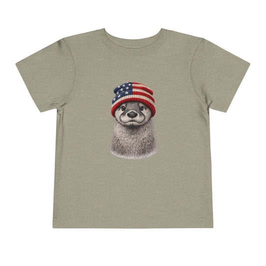 Otter in a USA flag knitted beanie, on a heather stone toddler shirt