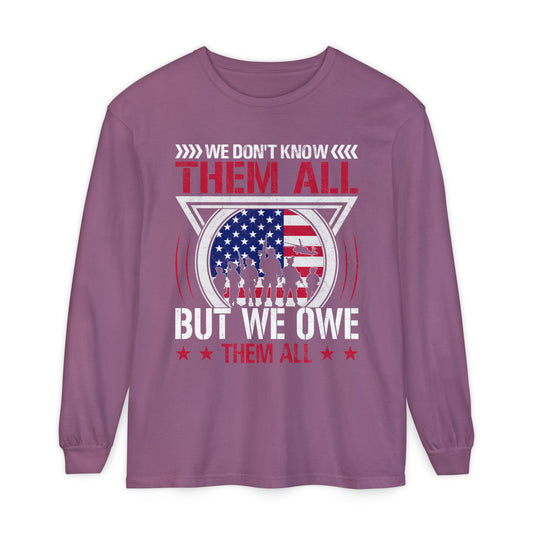 We Don't Know Them All, But We Owe Them All chest print on a berry pink women's long sleeve shirt