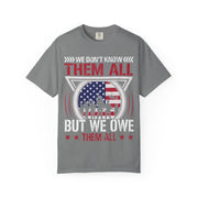 We Don't Know Them All, But We Owe Them All chest print on a grey women's shirt