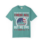 We Don't Know Them All, But We Owe Them All chest print on a seafoam green women's shirt
